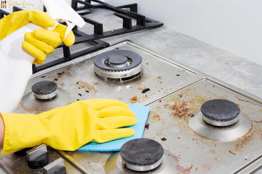 Cleaning-a-gas-stove-with-kitchen-ink